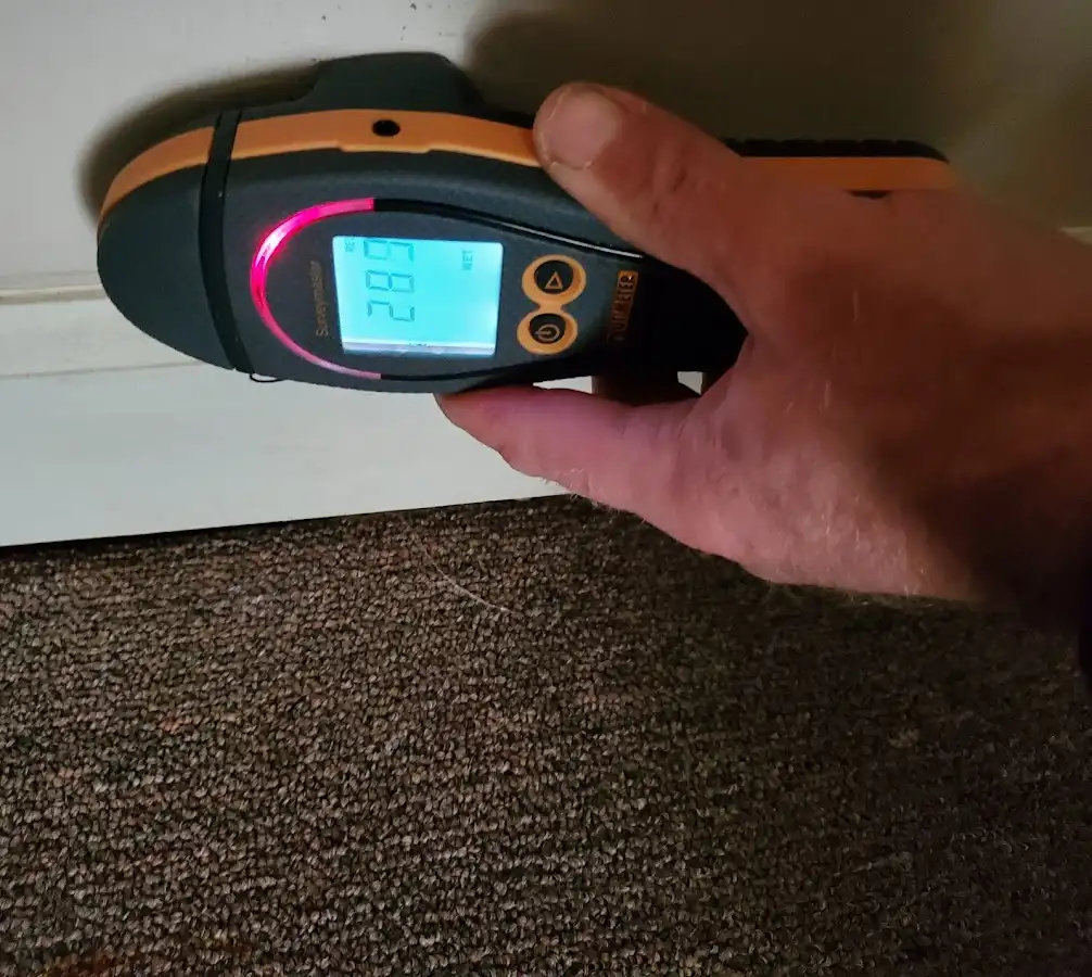Moisture detection at baseboard during Storm Damage Restoration in Clewiston